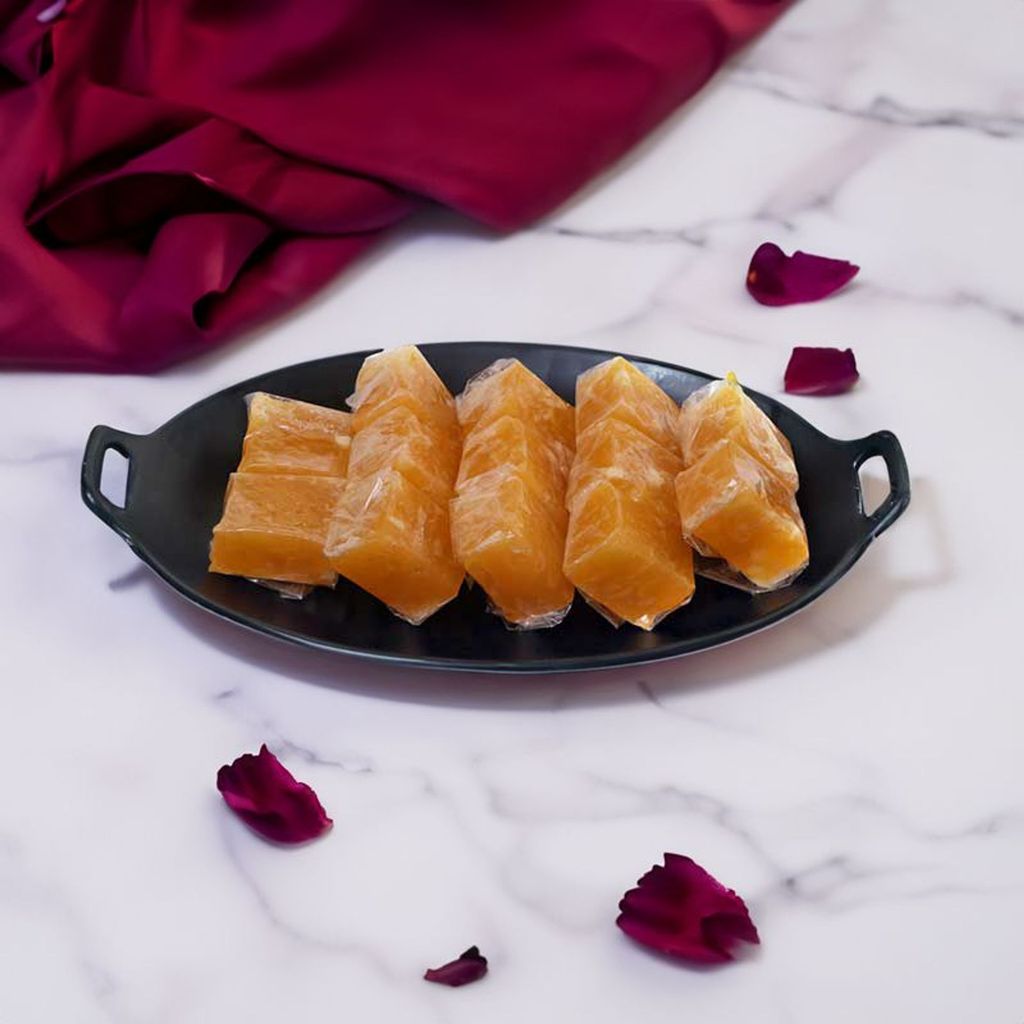 Bombay Halwa dessert with a glossy finish, rich texture, and a garnish of nuts.
