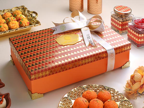collection of colorful Indian sweet boxes and gift hampers