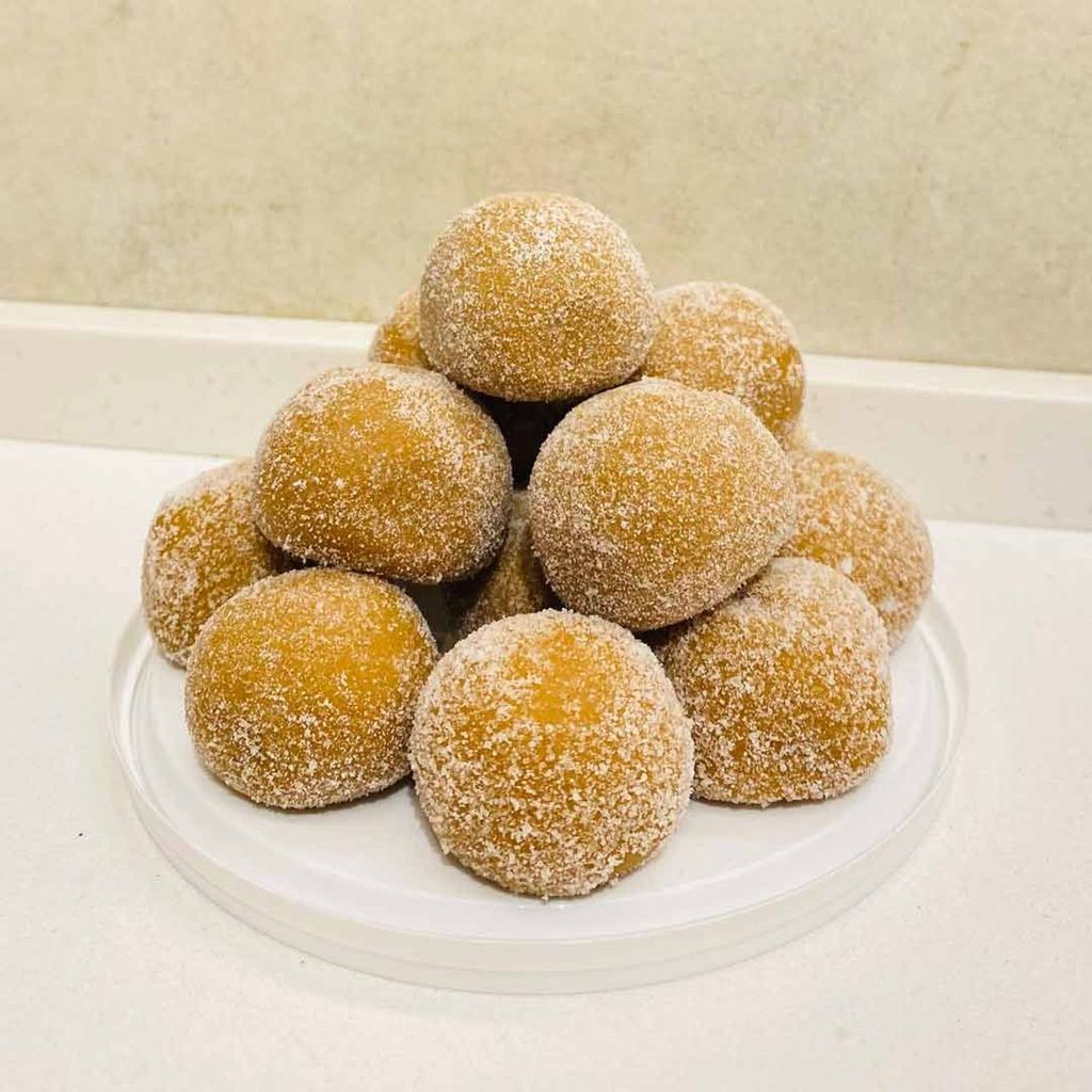 Dharwad Peda dessert showcasing a soft, golden milk sweet with a hint of cardamom.