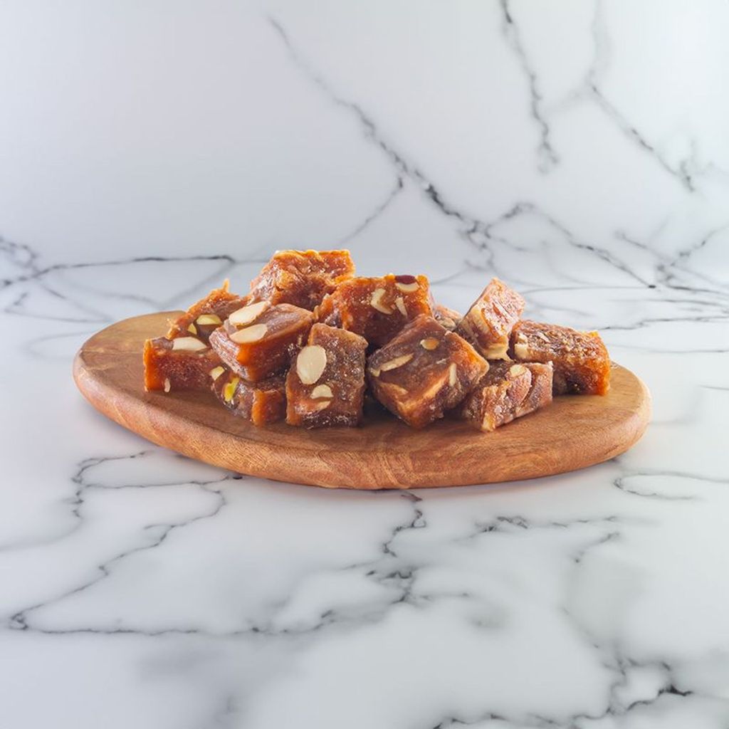 Dry Chocolate Roll dessert featuring a crisp, rolled pastry with a rich chocolate center dusted with cocoa powder.