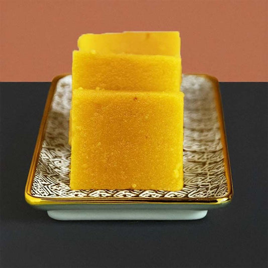 Special Mysore Pak from MithaiCana – traditional Indian sweet made with gram flour, sugar, and pure ghee, showcasing a golden hue and porous texture.